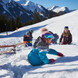 Familie im Schnee | © Daniel Roos Rodeln mit Kindern in Saalbach | © Daniel Roos
