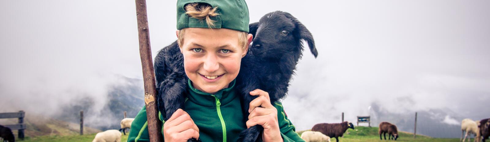 Young shepherd with lamb | © Edith Danzer